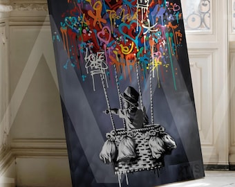 May include: A framed canvas art print featuring a child in a swing basket, with colorful graffiti art above. The artwork has a dark gray background with a child pointing to the right. The graffiti includes hearts, crowns, and the word "LOVE".