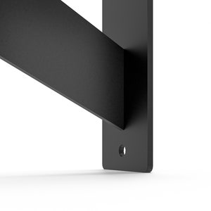 May include: Black metal shelf bracket with a single hole for mounting.