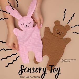 May include: A pink bunny and a brown bear sensory toy with closed eyes and a crinkly sound. The toys are made of soft fabric and are designed for babies. The text "Sensory Toy" is displayed in a cursive font.