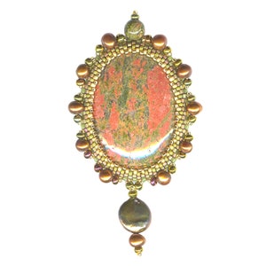 May include: A pendant featuring a large, oval-shaped, red and green stone surrounded by a beaded frame of gold, brown, and green beads. A single, pearlescent, brown bead hangs from the bottom of the pendant.