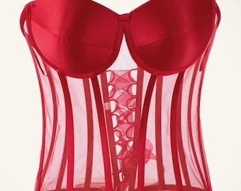 May include: A red satin and mesh corset with a lace-up front. The corset has a strapless design and is made of a sheer mesh fabric with red satin trim.