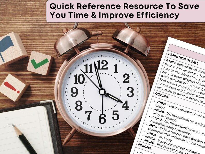 May include: A rose gold alarm clock with a white face and black numbers sits on a wooden surface. Beside the clock are wooden blocks with symbols and a notepad with a pencil. A document with text is also visible.