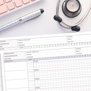 May include: A medical setting still life featuring a stethoscope, a silver pen, a pink keyboard, and two medication administration record sheets. The sheets have sections for medication, allergies, and hourly records.
