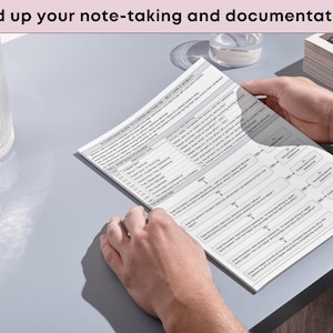 May include: A person holding a printed document with text. The document is white with black text and flow chart diagrams. The text at the top of the image reads: "Speed up your note-taking and documentation."
