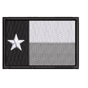 May include: Black and white embroidered patch of the Texas state flag with a white star in the centre.