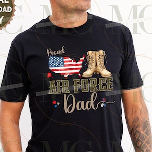 May include: Black t-shirt with a graphic that says "Proud Air Force Dad." The design includes an American flag map, tan boots, and the words "Air Force Dad" in a military-style font. The words "Digital Download Only" are also present.