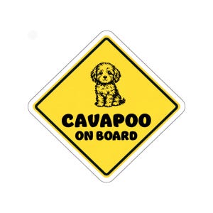May include: Yellow diamond-shaped sign with a black border. The sign features a black illustration of a Cavapoo dog and the words "CAVAPOO ON BOARD" in bold black letters. The background is yellow.