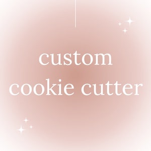 May include: A pink and white gradient background with the text "custom cookie cutter" in white. There are two small white stars on the left and right sides of the text.