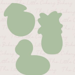 May include: Three cookie cutters in the shape of a duck, a pineapple, and a pear. The cookie cutters are a light green color.