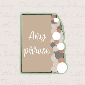 May include: A beige sticker with a green border. The sticker has a white background and the text "Any phrase" written in white cursive font. The right side of the sticker has a decorative border of beige, brown, and white circles.