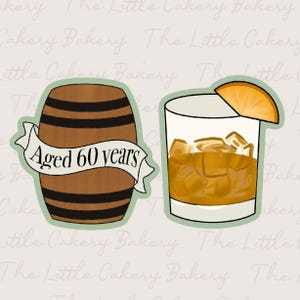 May include: Illustration of a wooden barrel with the text "Aged 60 years" on a banner, next to a cocktail glass filled with ice and a slice of orange. The image is a design for a bakery.