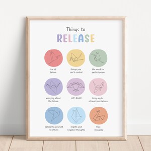 May include: A printable poster with the text "Things to RELEASE" in rainbow colors. The poster features nine origami cranes, each with a different color and a phrase below it, such as "fear of failure", "things you can't control", and "past mistakes".