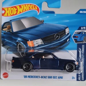 May include: A set of three ceramic mugs with a speckled, matte finish. The mugs are in shades of cream, light gray, and dark gray. Each mug has a simple, modern design and a rounded handle.