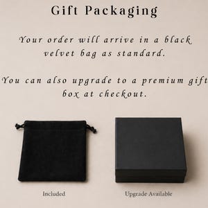 May include: Image showing gift packaging options. A black velvet bag with a drawstring closure is labeled "Included." A black box with a lid is labeled "Upgrade Available."
