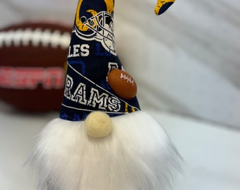 LA Rams football gnome stands 10”. This would be a fun addition to your gnome sports collection! Score this today! Cello gift wrapped.