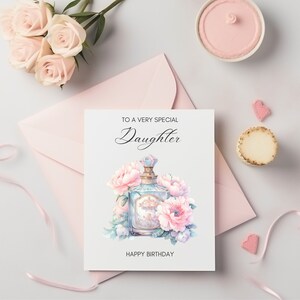 Puede incluir: Una tarjeta blanca con el texto "To a very special Daughter" y una ilustraci&oacute;n de acuarela de un frasco de perfume con flores rosas. La tarjeta tambi&eacute;n dice "Happy Birthday".