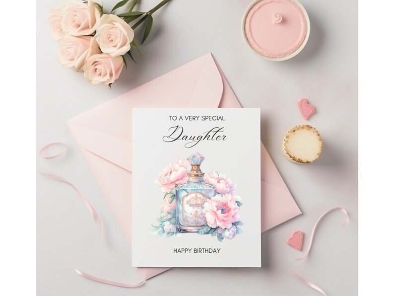 Puede incluir: Una tarjeta blanca con el texto "To a very special Daughter" y una ilustraci&oacute;n de acuarela de un frasco de perfume con flores rosas. La tarjeta tambi&eacute;n dice "Happy Birthday".