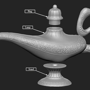 May include: A gray, detailed genie lamp with a removable plug and a separate stand. The lamp has intricate designs and a curved spout.