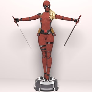 May include: A red and black action figure of a female superhero holding two swords. The figure is standing on a black and silver base.