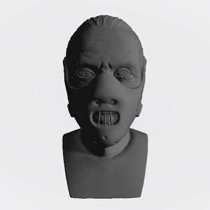 May include: A gray bust sculpture of a person wearing a mask with a mouth guard. The mask has a wide, open mouth with a metal bar across it.