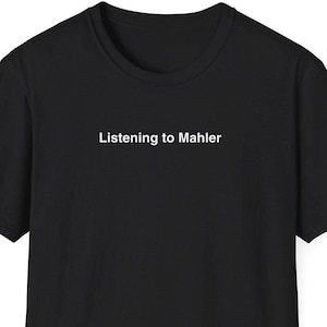 May include: Black t-shirt with the text "Listening to Mahler" in white, centered on the chest. The shirt has short sleeves and a crew neck. The background is plain white.