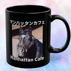 May include: Black ceramic mug featuring a portrait of a black horse with a white blaze and a brown bridle. The mug has the Japanese text "マンハッタンカフェ" and the English text "Manhattan Cafe" printed on it.