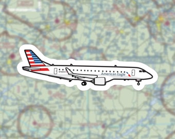 May include: A white airplane with a blue and red American flag on the tail. The airplane has the text "American Eagle" on the side. The registration number N763CC is visible on the fuselage.