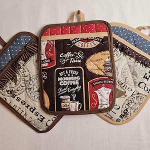 May include: A set of three ceramic mugs with a speckled, matte finish. The mugs are in shades of cream, light brown, and dark brown. Each mug has a simple, minimalist design, perfect for coffee or tea.