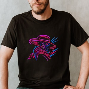 May include: A black t-shirt with a neon pink and blue graphic of a person wearing a hat and a gas mask. The graphic is stylized and has a retro feel.