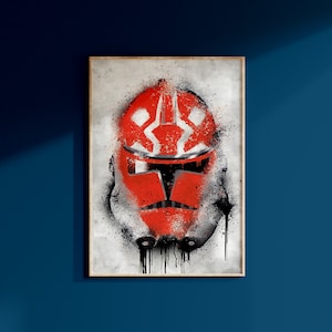 May include: A red and white Star Wars clone trooper helmet with black paint splatters on a white background.