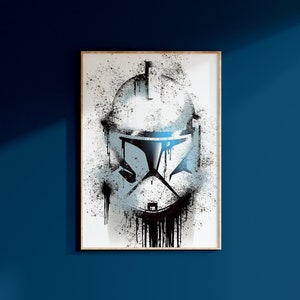 May include: A black and white illustration of a Star Wars clone trooper helmet with a splatter paint effect. The helmet is dripping with black paint.