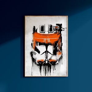 May include: A black and white illustration of a Star Wars clone trooper helmet with orange accents. The helmet is depicted in a graffiti style with drips of black paint.