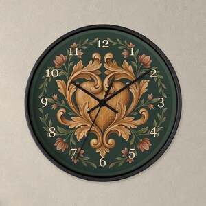 May include: A round wall clock with a black frame and a dark green face. The center features a light brown wooden heart surrounded by ornate, symmetrical acanthus leaf carvings. The clock has black hands and gold-colored numerals.
