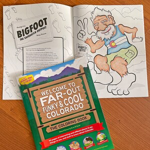 May include: A green and brown sign that says "Welcome to Far-Out Funky & Cool Colorado" with a coloring book titled "The Coloring Book" underneath. The book cover features a cartoon Bigfoot and a chicken. The book has 44 pages of interesting and offbeat places to go, things to see, and stuff to know about Colorado.
