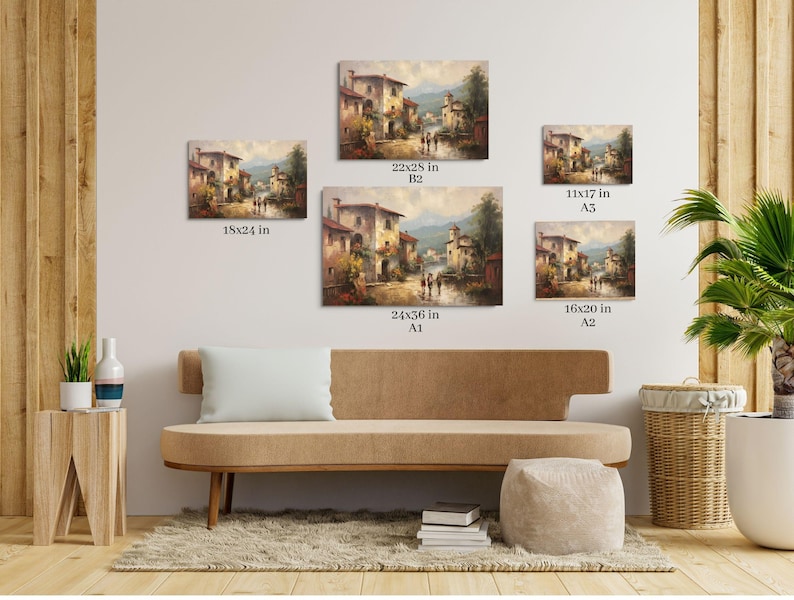 Pu&ograve; includere: Un interno di soggiorno con un divano beige e un tavolino di legno. La parete &egrave; decorata con cinque quadri incorniciati che raffigurano un pittoresco villaggio italiano con edifici colorati, una strada acciottolata e una vegetazione lussureggiante. I quadri sono di diverse dimensioni, con le dimensioni indicate sotto ciascuno.