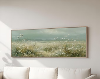 Peut inclure: Peinture de paysage rectangulaire encadrée représentant un champ d'herbes hautes et de fleurs sauvages dans des tons verts, jaunes et blancs. L'œuvre a un style doux et impressionniste, avec un ciel nuageux en arrière-plan. Le cadre est en bois clair.