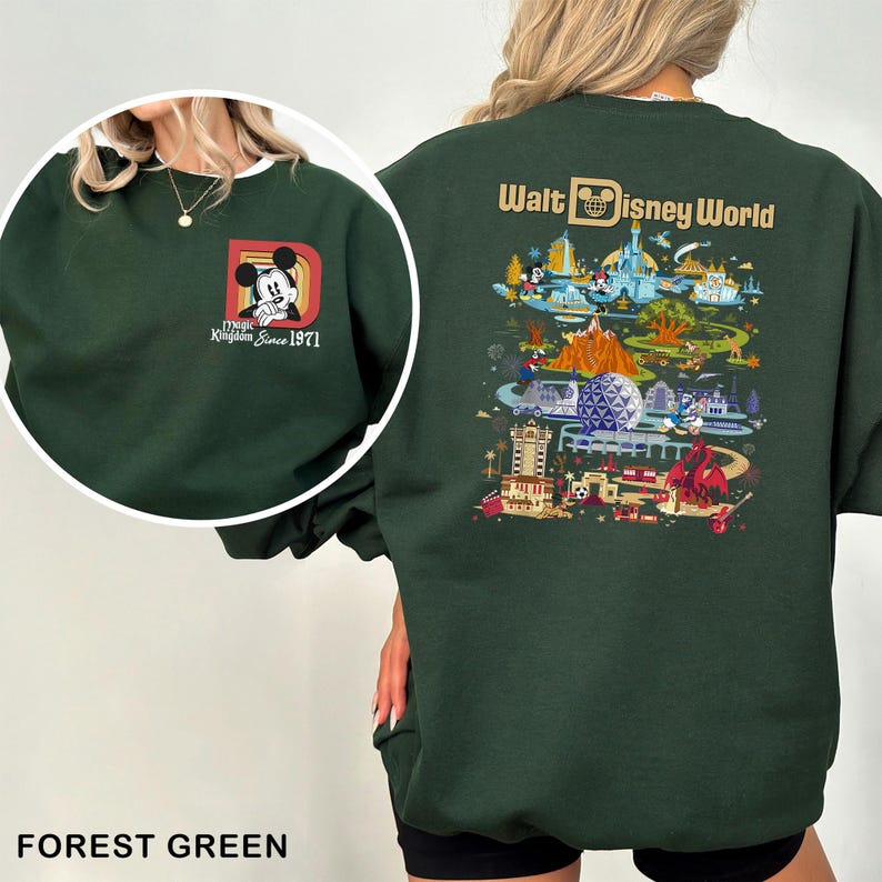 May include: Forest green sweatshirt featuring a Mickey Mouse graphic on the front and a Walt Disney World illustration on the back. The front graphic includes the text "Magic Kingdom Since 1971". The sweatshirt is a solid forest green color.
