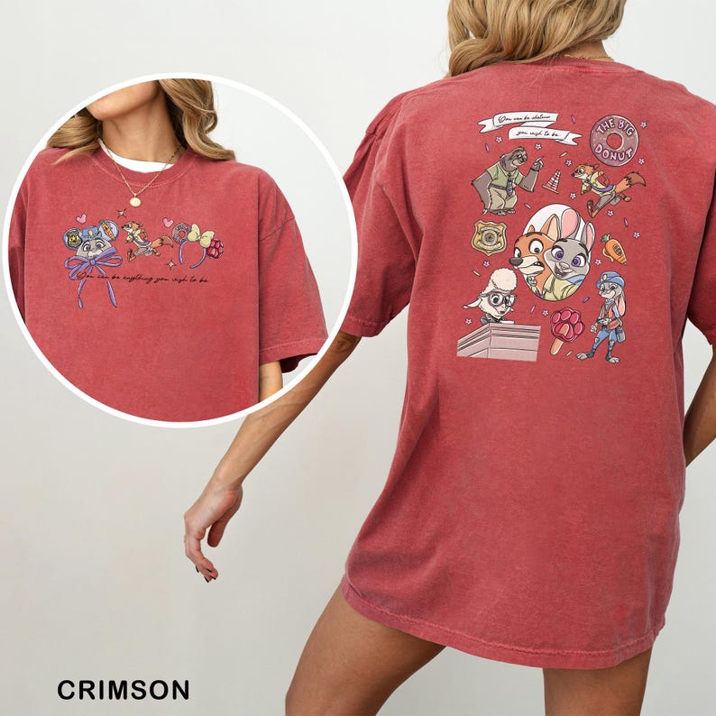 May include: Crimson t-shirt with cartoon graphics and text. The front has a circular graphic with a character and text. The back features multiple cartoon characters and the words "The Big Donut".