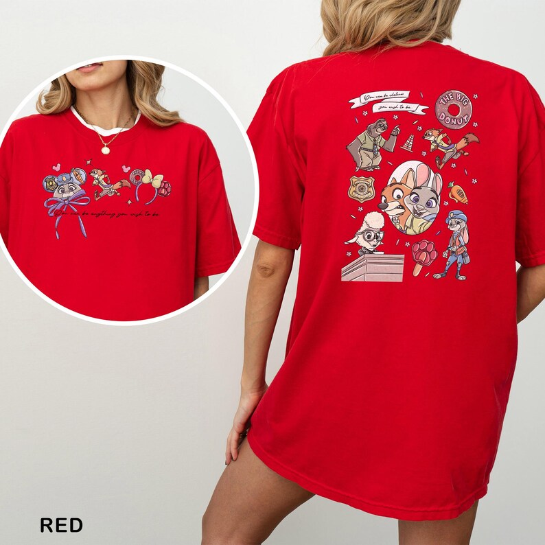 May include: Red t-shirt with cartoon characters and text. The front has a circular design with cartoon characters and the text "...for anything your heart to be". The back has a larger design with more cartoon characters and the text "THE BIG DONUT".