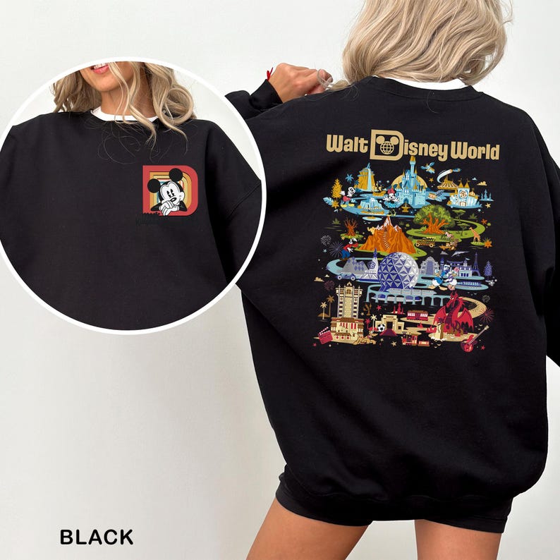 May include: Black sweatshirt featuring a Mickey Mouse graphic on the front and a colorful Walt Disney World design on the back. The sweatshirt has a white collar and the word "BLACK" is printed at the bottom.