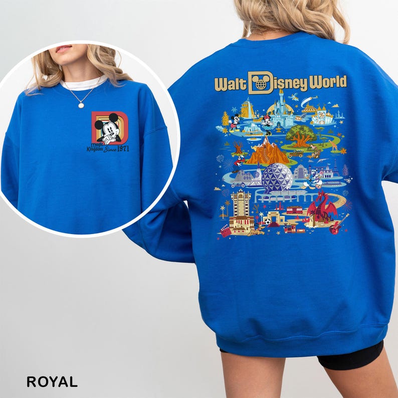 May include: Royal blue sweatshirt featuring a Mickey Mouse graphic on the front and a colorful Walt Disney World design on the back. The front graphic includes the text "Magic Kingdom Since 1971".