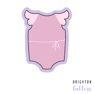 May include: A pink baby onesie with a bow and angel wings. The onesie is outlined in black and has a light purple background.