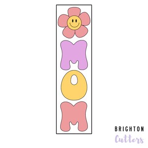 May include: A set of cookie cutters in the shape of the word "MOM" with a flower on top. The letters are in different colors: purple, yellow, and pink. The flower is pink with a yellow smiley face.
