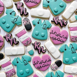 May include: Assortment of decorated sugar cookies featuring a nurse theme. Cookies include scrubs, stethoscopes, bandages, pills, and the words "RN" and "Thank You".