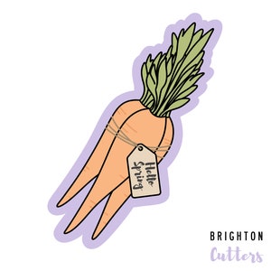 May include: A sticker of two orange carrots tied together with twine and a tag that says "Hello Spring". The carrots have green leafy tops.