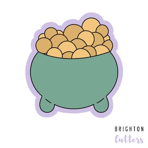 May include: A green cauldron filled with gold coins. The cauldron has three legs and is outlined in black. The coins are yellow and have a light brown outline. The image is on a light purple background with the text "Brighton Cutters" in purple.