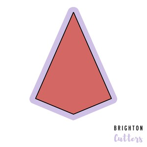 May include: A pink geometric shape with a black outline and a light purple border. The shape is a triangle with rounded edges. The text "Brighton Cutters" is written in purple below the shape.