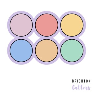 May include: Six round, pastel-colored cookie cutters in a row. The colors are light purple, pink, yellow, light blue, peach, and light green.
