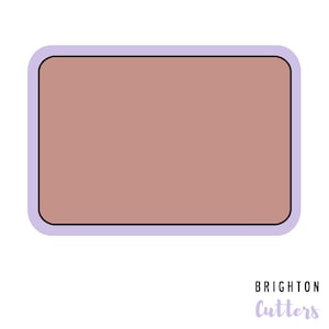 May include: A light purple rectangle with a rounded border and a brown interior. The text "BRIGHTON Cutters" is written in a light purple font below the rectangle.