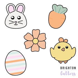 May include: A set of five Easter-themed cookie cutters. The cutters are shaped like a bunny, a chick, a flower, an egg, and a carrot. The cutters are white with black outlines and have a cartoon-like style.